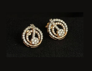 14KT Gold Geometric Ribbon Diamond Earrings | Certified IGI, Gross Wt: 3.42, Net Wt: 3.29, Diamond. Wt 0.65 14KT Gold Geometric Ribbon Diamond Earrings | Certified IGI, Gross Wt: 3.42, Net Wt: 3.29, Diamond. Wt 0.65