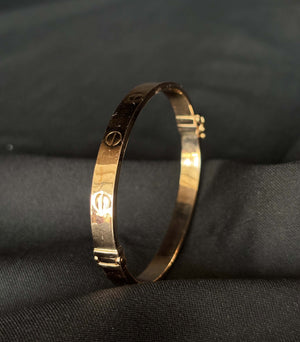 22K Gold Bangle with Iconic Screw Motif 22K Gold Bangle with Iconic Screw Motif