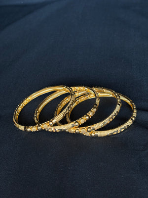 22K Gold Bangle Set with Intricate Beadwork from Premsay Jewellers 22K Gold Bangle Set with Intricate Beadwork from Premsay Jewellers