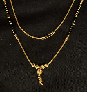 22K Gold and Black Bead Mangalsutra Necklace with Floral Pendant 22K Gold and Black Bead Mangalsutra Necklace with Floral Pendant