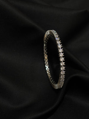 925 sterling silver bangle adorned with sparkling cubic zirconia stones. 925 sterling silver bangle adorned with sparkling cubic zirconia stones.