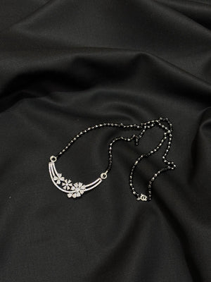 925 sterling silver mangalsutra blends tradition with modern elegance. Featuring a delicate floral design 925 sterling silver mangalsutra blends tradition with modern elegance. Featuring a delicate floral design