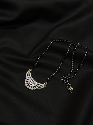 925 sterling silver mangalsutra blends tradition with modern elegance. Featuring a delicate floral design. 925 sterling silver mangalsutra blends tradition with modern elegance. Featuring a delicate floral design.