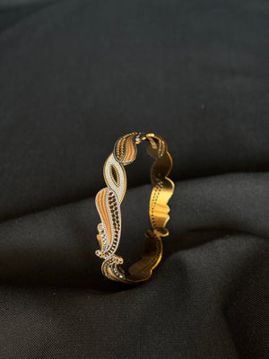 22K Gold Bangle with Flowing Two-Tone Design.