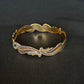 22K Gold Bangle with Flowing Two-Tone Design.