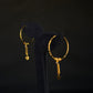 Elegant 22K Gold Hoop Earrings with Dangling Pendant Details.