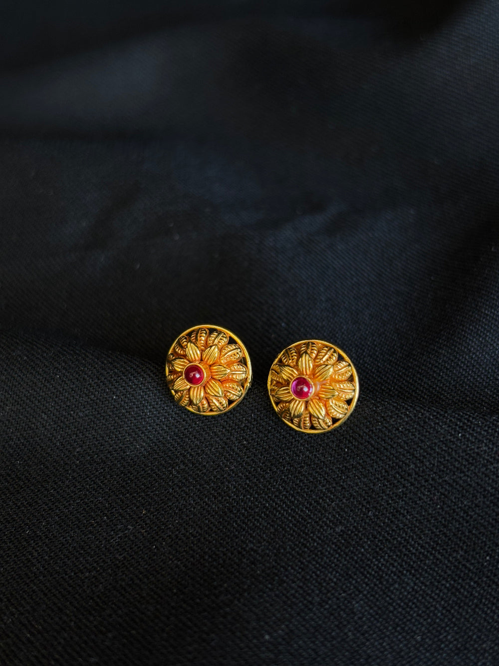Elegant 22K Gold Floral Stud Earrings with Gemstone Center.