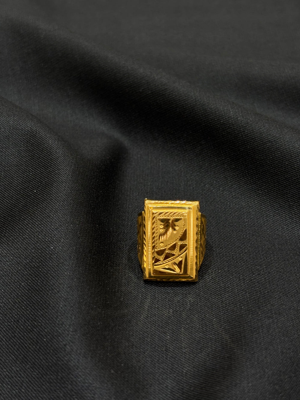 22K Gold Gents Ring with Rectangular Setting & Intricate Central Motif.