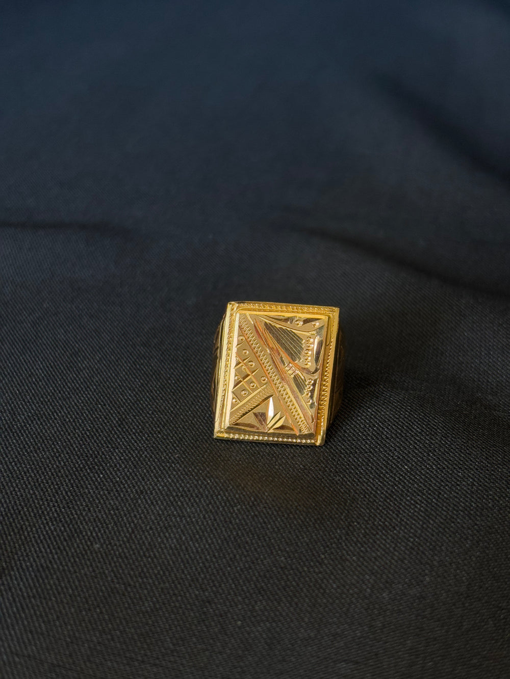 22K Gold Gents Ring with Rectangular Setting & Intricate Geometric Patterns.