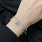 Divine Eye & Bow Sterling Silver Charm Tennis Bracelet